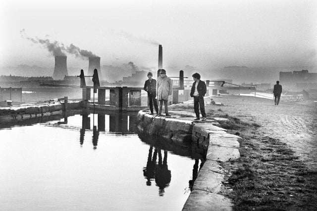 A moody view on the canal locks in Ince with Westwood power station in full flow in 1971.