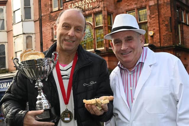 Ian Coulton, 48, from Orrell was crowned winner, pictured with Pie-master Tony Callaghan, right.