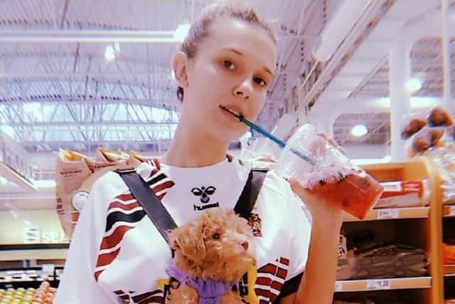 Millie Bobby Brown out shopping with her pet dog