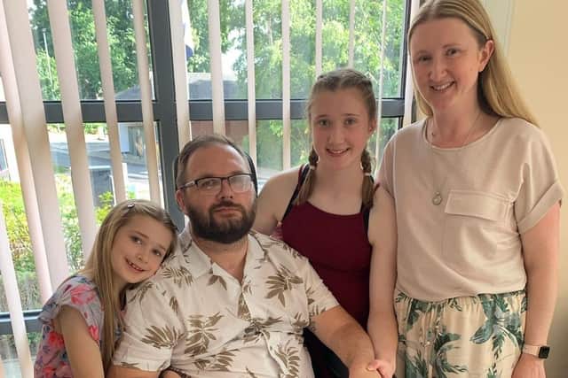 Darren White with his wife Jo and two daughters Abbie and Lola