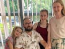 Darren White with his wife Jo and two daughters Abbie and Lola