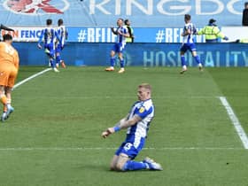 James McClean celebrates his early goal for Latics