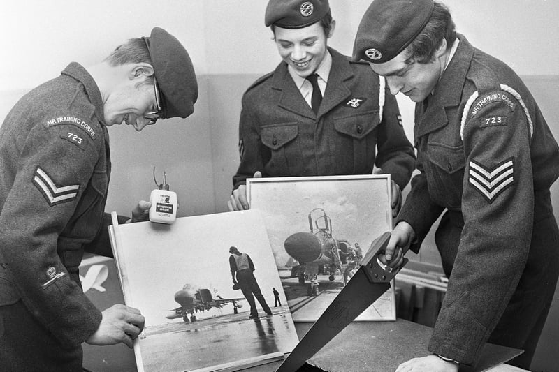 Framing aircraft pictures are, left to right, Cpl. Ian Parkinson, Cpl. Allan Taberner and Sgt. Paul Heyes of the Wigan Air Training Corps squadron on Friday 24th of November 1972.