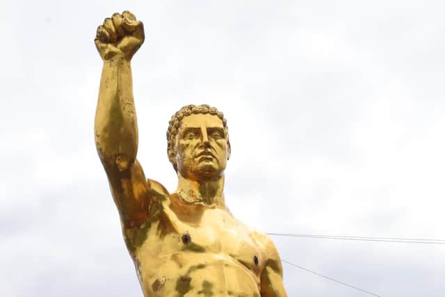 A 40ft gold statue of a naked Greek god has appeared on Manchester Road, Ince, near Darlington Street.