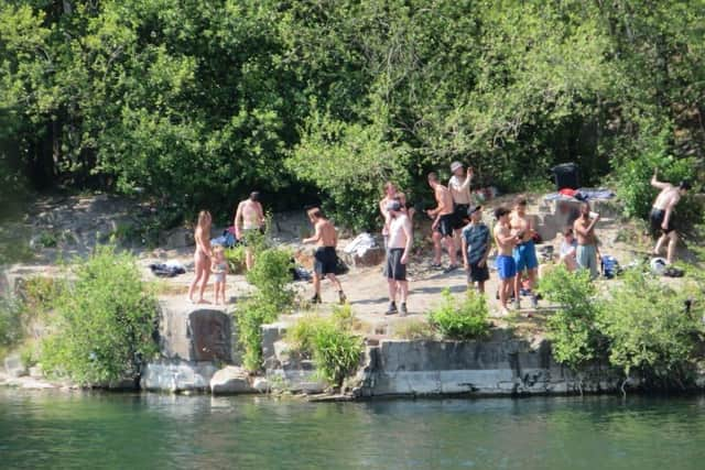 People at the East Quarry, Appley Bridge, treating it like a beach in the summer of 2020