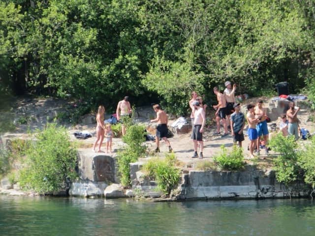 People at the East Quarry, Appley Bridge, treating it like a beach in the summer of 2020