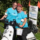 Chris McCormick doing a charity mobility scooter ride from Dundee to Wigan on behalf of Alzheimer's Society with his grandaughter Chloe