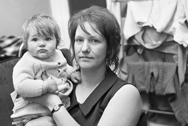 Resident, Jean Mortimor, with one of her four children in Chapel Street, Lower Ince, in December 1971.