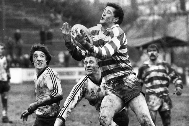 Wigan full-back Barry Williams leaps above challengers in a league match against Widnes at Central Park on Sunday 27th of February 1983.
The match was a 6-6 draw.