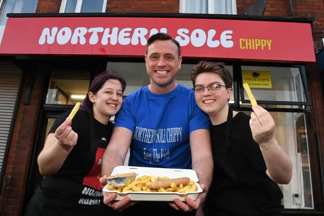 Jonny Wood, centre, owner of Northern Sole fish and chip shop, Gidlow Lane, Wigan, he opened in September 2023, pictured with staff members Imogen Johnson, left, and Archer Wood, right.