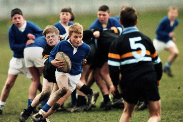 Action from a schoolboy rugby league match between St. Peter's RC High School, Orrell, and The Deanery High School, Wigan, on Tuesday 26th of March 1996.