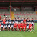 Lancashire and Yorkshire embrace after the Women's Origin fixture at Sewell Group Craven Park