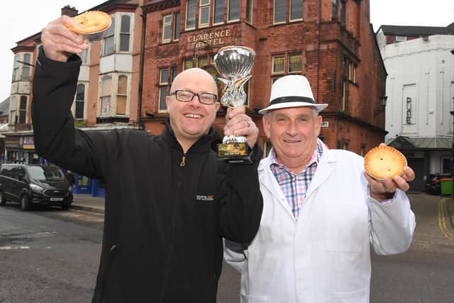 Last year's World Pie-Eating champion Barry Rigby receiving his award from Piemaster Tony Callaghan