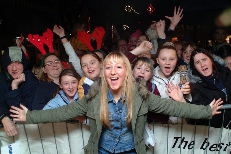 Wigan's Lauren Waterworth celebrates the Christmas lights switch on in the town centre with her army of young fans in 2002