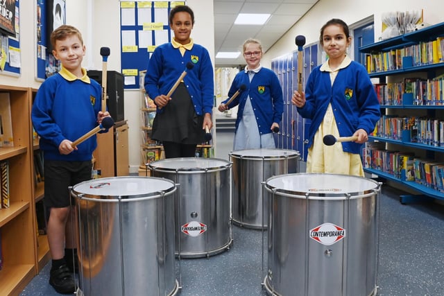 Year Four pupils taking part in drumming lessons as the whole year are currently practising for their samba drumming concert in June.