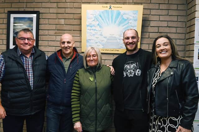 A painting in memory of Sam Leiper and other people who have taken their own lives has been unveiled at Shevington Library. Pictured are artist Alan Baybutt, Sam's dad Andy, mum Debby and brother Josh, with Ellie Palma-Cass, founder of Epic Hope