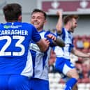 Dale Taylor celebrates his equaliser at Northampton with James Carragher