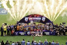 Wigan Warriors lifting the Challenge Cup at Wembley in 2024