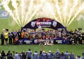 Wigan Warriors lifting the Challenge Cup at Wembley in 2024