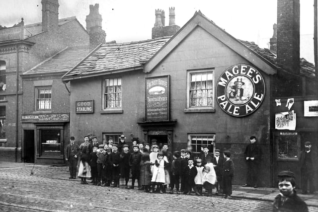 The Packet House Inn at the bottom of Wallgate near Caroline Street in the late 1800s. The name of Thomas O Ryder is over the door and next door is a shop selling tripe and oysters, chipped potatoes and fried fish.