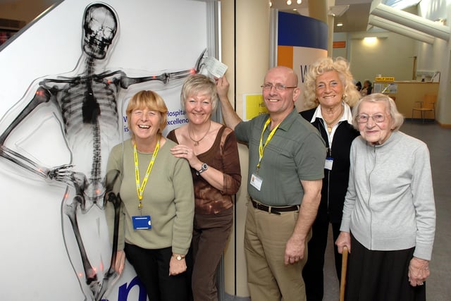 Wrightington Hospital League of Friends volunteers Barbara Lambert, left, Sandra Woods, Olwen Winstanley and Betty Turner present fellow committee member Jim Taylor, also a member of the Handicapped Children's Pilgrimage Trust with a cheque for £450 raised through car boot sales in summer. The money will help send a child to Lourdes at Easter.