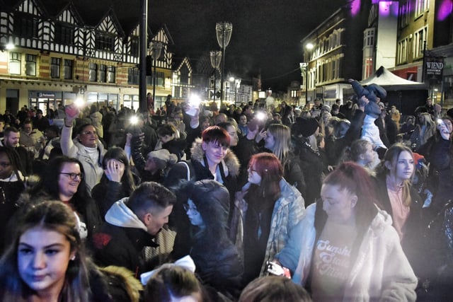 People gather in the streets of Wigan centre.