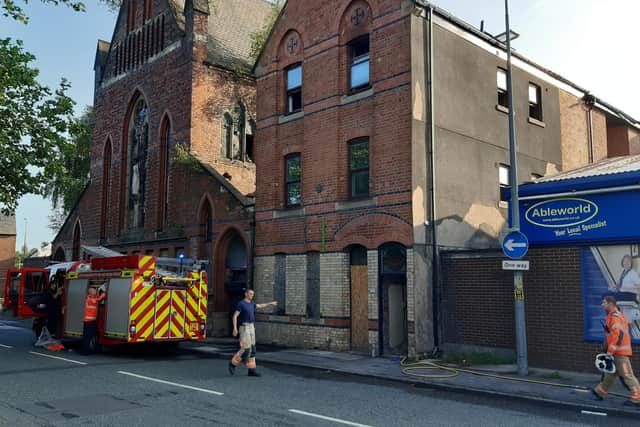 Four fire engines were involved in tackling the blaze at semi-refurbished flats on Caroline Street next to the abandoned St Joseph's Church
