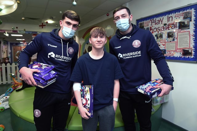 A fan meets players at Wigan Warriors visit young patients on the Rainbow Ward at  Royal Albert Edward Infirmary, Wigan.