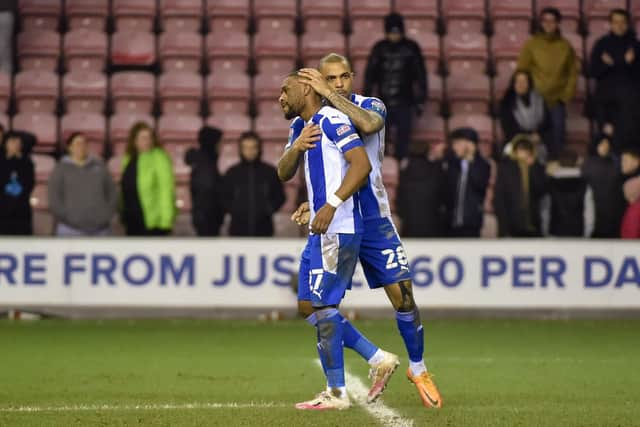 Josh Magennis consoles Tendayi Darikwa after his penalty miss against Sutton