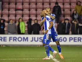 Josh Magennis consoles Tendayi Darikwa after his penalty miss against Sutton