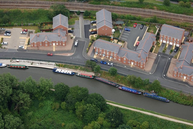 WIGAN AERIAL PICTURES 2005 - The Leeds & Liverpool Canal, Appley Bridge, bordered by Herons Wharf and the Wigan to Southport railway line.