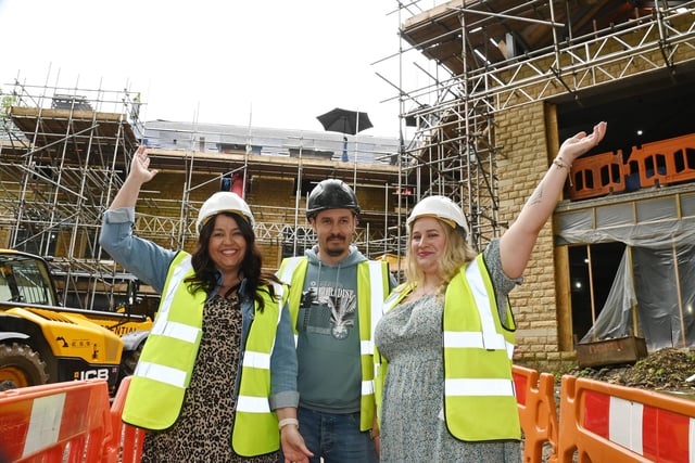 Stacey Astin, left, and Charlotte May from Millennium Care with site manager George Zavelca - celebrate the new building. Residents, staff and visitors enjoyed a summer party in celebration of the topping out, roof at Langtree Care Home, part of the Millennium Care Group - Standish Care Village, off Chorley Road, Standish.