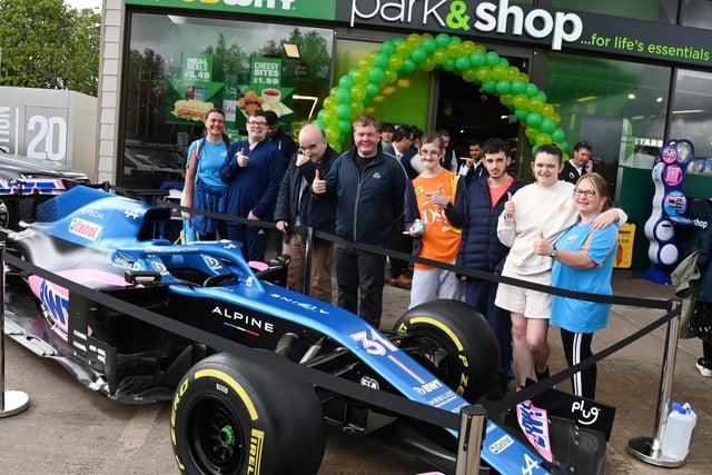 One Vision group with the Alpine Formula One car on display