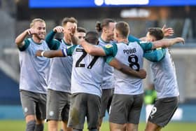 The Latics players celebrate the opening goal of the Kolo Toure era at Millwall last week