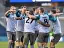 The Latics players celebrate the opening goal of the Kolo Toure era at Millwall last week