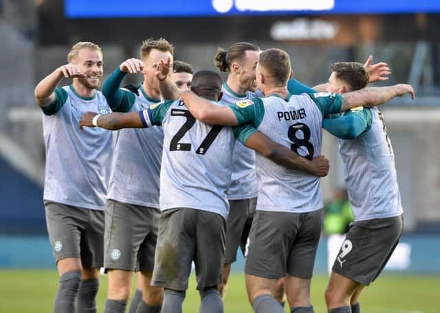The Latics players celebrate the opening goal of the Kolo Toure era at Millwall last week