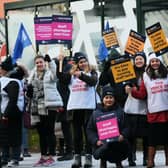 Nurses waved flags and carried placards on the picket line