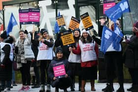 Nurses waved flags and carried placards on the picket line