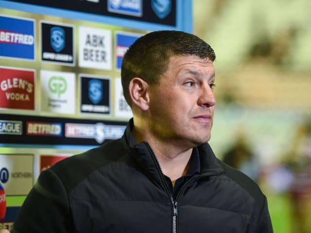 Wigan Warriors moved one step closer to retaining the League Leaders' Shield with a 38-0 win over Leeds Rhinos