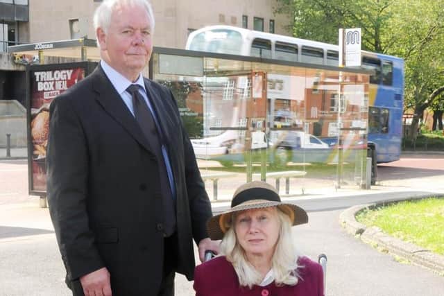 John Greenwood with the un-named disabled woman for whom he acts as carer