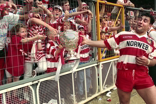 Kelvin Skerrett jokes with Wigan fans as the trophy is paraded after beating Widnes 20-14 in the Challenge Cup Final at Wembley on Saturday 1st of May 1993.