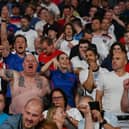 England supporters celebrate after winning the UEFA EURO 2020 semi-final football match between England and Denmark at Wembley Stadium in London on July 7, 2021. (Photo by Paul ELLIS / POOL / AFP) (Photo by PAUL ELLIS/POOL/AFP via Getty Images)