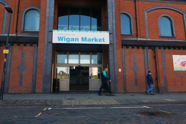 One of the few remaining entrances to Wigan market but the bus stop nearby, which is handy for older and disabled people to be dropped off, has been shut