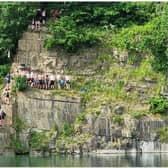 An old picture of teenagers jumping in the quarry in Appley Bridge