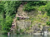 An old picture of teenagers jumping in the quarry in Appley Bridge