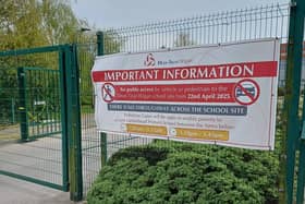 A banner with details of public access restrictions has been placed outside Dean Trust Wigan