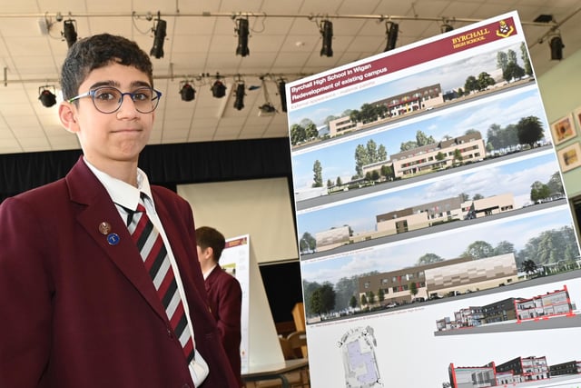 Pupils take a look at the designs for their new school building.