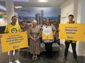 Marie Curie Healthcare Assistant Linda McCarten with campaigners, handing in the petition