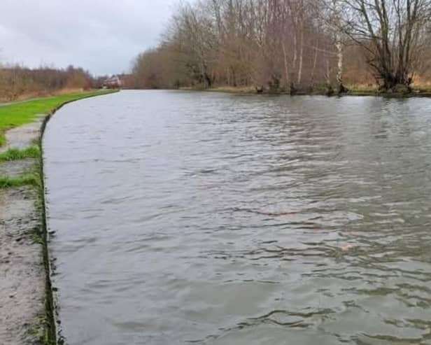 The Leeds and Liverpool Canal close to overflowing near the site