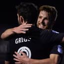 Will Grigg and Michael Jacobs will be waiting when Chesterfield host Latics next month